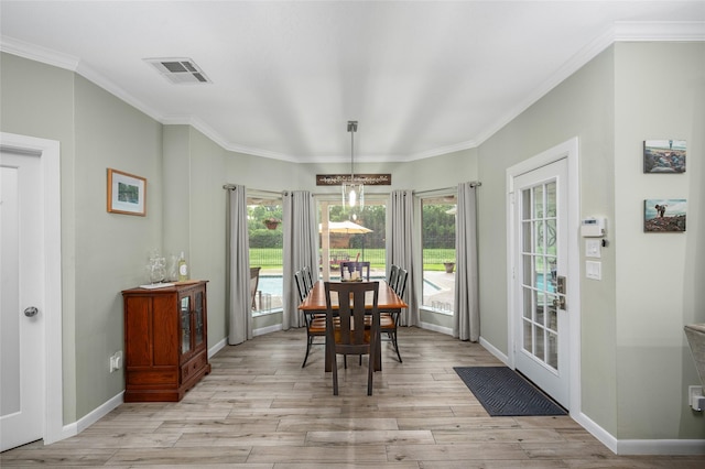 21215 Kelliwood Greens Dr, Katy, TX 77450 - dining area featuring plenty of natural light, light wood-style flooring, and ornamental molding