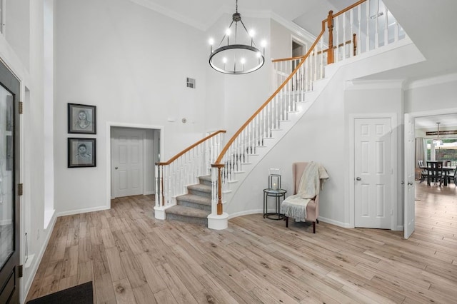 21215 Kelliwood Greens Dr, Katy, TX 77450 - entrance foyer with a chandelier, a high ceiling, stairs, ornamental molding, and wood finished floors