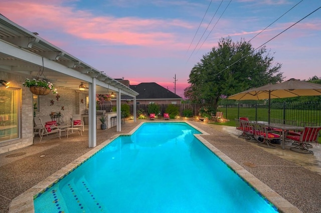 21215 Kelliwood Greens Dr, Katy, TX 77450 - pool at dusk with a patio area and a fenced backyard