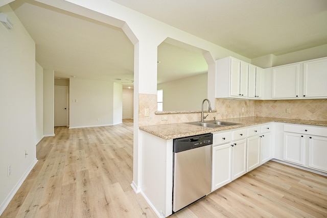 2046 Grand Park Dr, Missouri City, TX 77489 - kitchen with stainless steel dishwasher, light wood-style flooring, and decorative backsplash