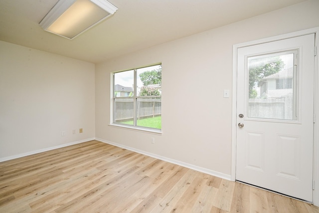 2046 Grand Park Dr, Missouri City, TX 77489 - foyer entrance with light wood-style floors and baseboards