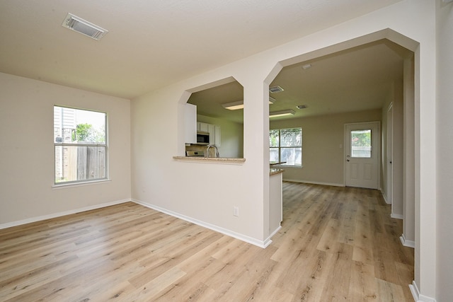 2046 Grand Park Dr, Missouri City, TX 77489 - empty room featuring light wood finished floors and baseboards