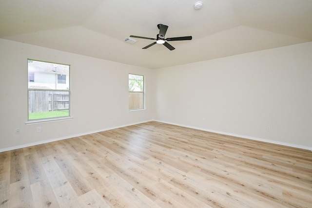 2046 Grand Park Dr, Missouri City, TX 77489 - unfurnished room featuring vaulted ceiling, light wood-style floors, a ceiling fan, and a smoke detector