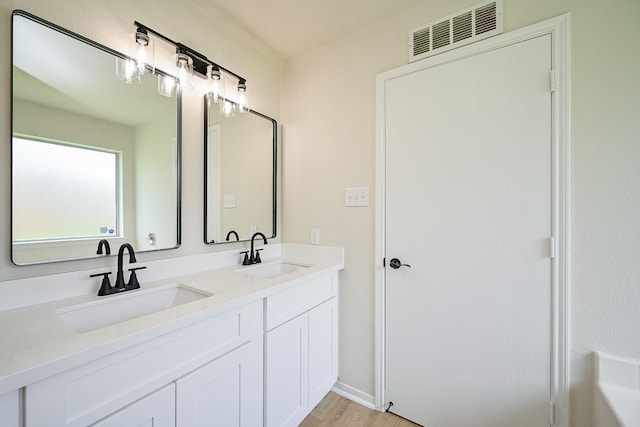 2046 Grand Park Dr, Missouri City, TX 77489 - full bath featuring double vanity and wood finished floors