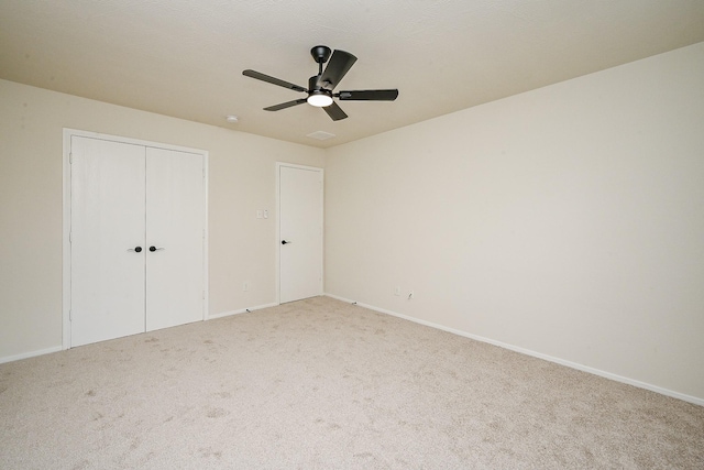 2046 Grand Park Dr, Missouri City, TX 77489 - unfurnished bedroom with light colored carpet, a closet, and ceiling fan