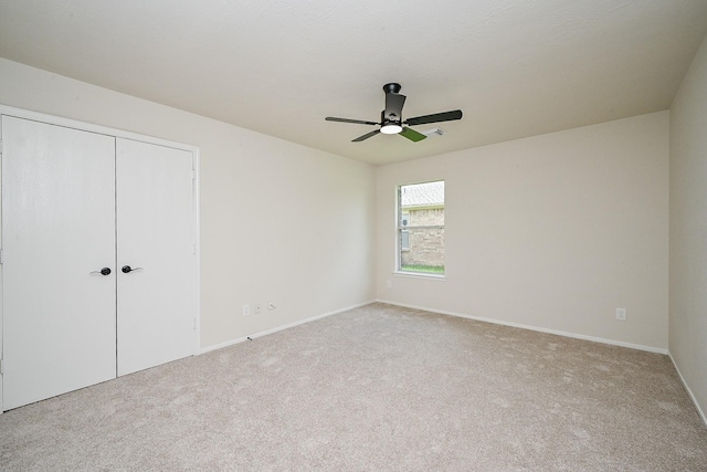 2046 Grand Park Dr, Missouri City, TX 77489 - unfurnished bedroom featuring carpet, a closet, and a ceiling fan