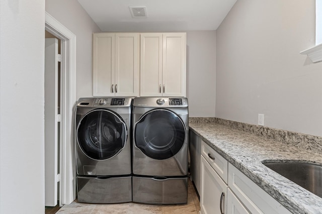 4303 Jonathan St, Bellaire, TX 77401 - laundry room with washing machine and dryer and cabinet space