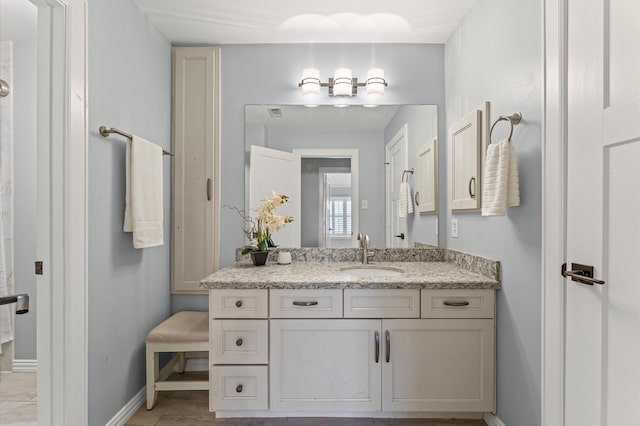 4303 Jonathan St, Bellaire, TX 77401 - bathroom with vanity and baseboards