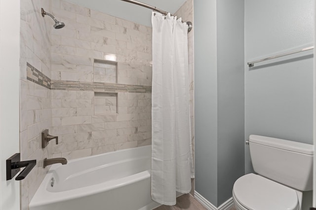 4303 Jonathan St, Bellaire, TX 77401 - bathroom featuring shower / bath combo with shower curtain and toilet