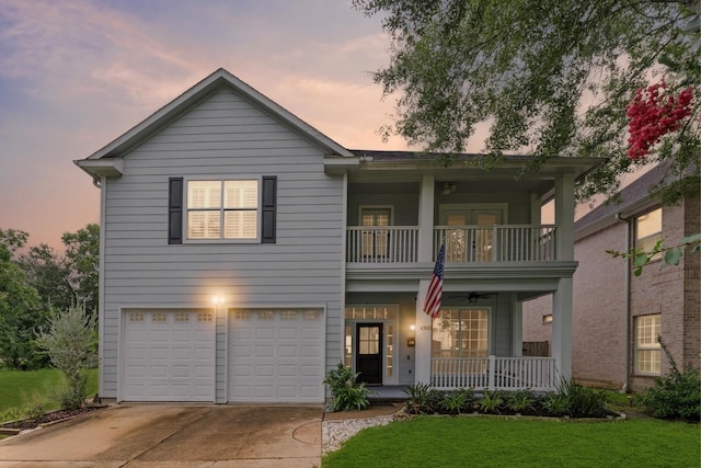 4303 Jonathan St, Bellaire, TX 77401 - view of front of property with a balcony, a porch, a garage, driveway, and a yard