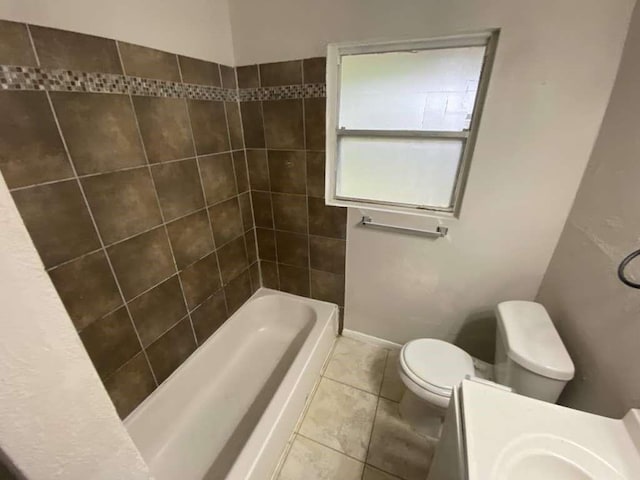 5322 Dewberry St, Houston, TX 77021 - bathroom featuring vanity, tile patterned floors, and washtub / shower combination