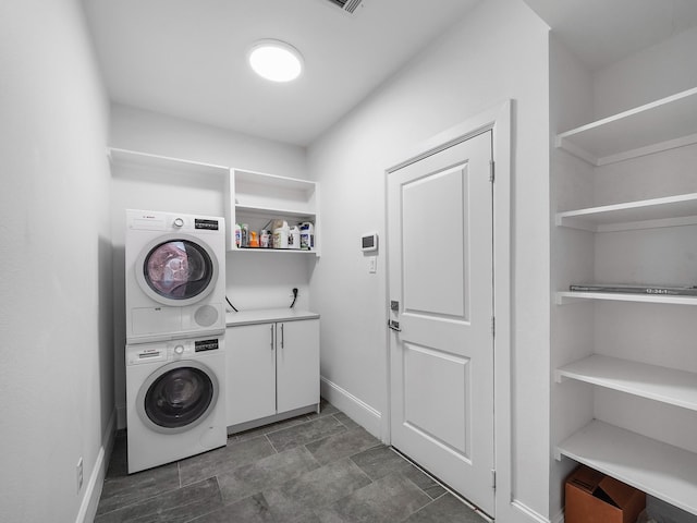 28111 Harper Creek Ln, Katy, TX 77494 - laundry area with stacked washer / dryer and cabinet space
