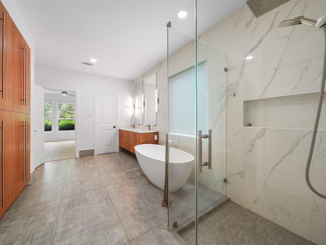 28111 Harper Creek Ln, Katy, TX 77494 - full bath featuring a marble finish shower, vanity, recessed lighting, a soaking tub, and a ceiling fan