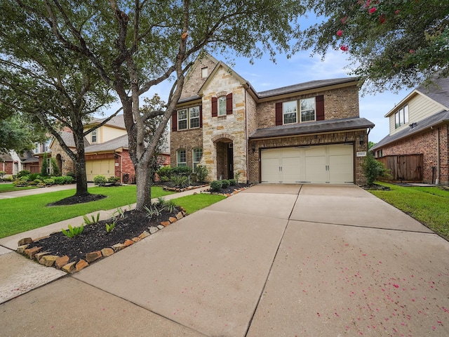 28111 Harper Creek Ln, Katy, TX 77494 - traditional-style home with driveway, a garage, brick siding, and stone siding