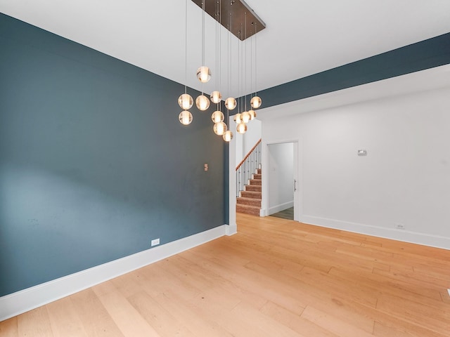 28111 Harper Creek Ln, Katy, TX 77494 - spare room featuring wood finished floors and stairs