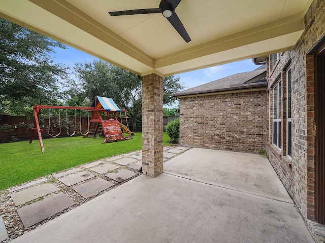28111 Harper Creek Ln, Katy, TX 77494 - fenced backyard featuring a playground, a ceiling fan, and a patio area