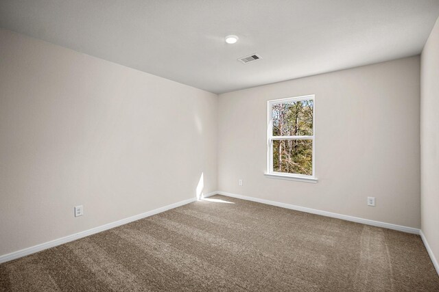 10377 Red Cardinal Dr, Cleveland, TX 77328 - carpeted empty room with baseboards