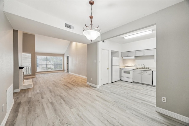 2100 Tanglewilde St Unit 360, Houston, TX 77063 - unfurnished living room featuring baseboards and light wood finished floors