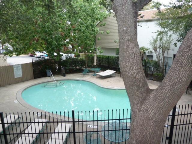 2100 Tanglewilde St Unit 360, Houston, TX 77063 - community pool with a patio