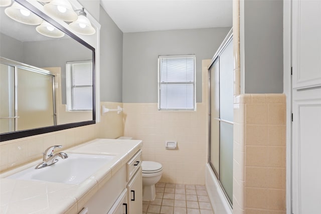 3808 Montego Dr, Baytown, TX 77521 - bathroom with tile walls, vanity, tile patterned floors, and wainscoting