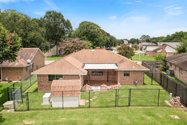 3808 Montego Dr, Baytown, TX 77521 - back of property featuring a gate, brick siding, a fenced backyard, and roof with shingles
