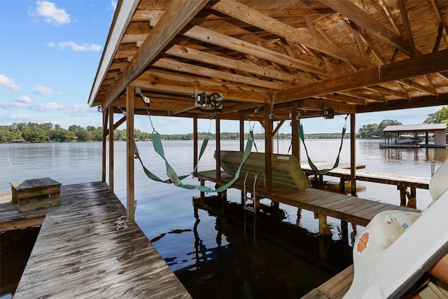 386 Dailey Rd, Crockett, TX 75835 - dock area featuring boat lift and a water view