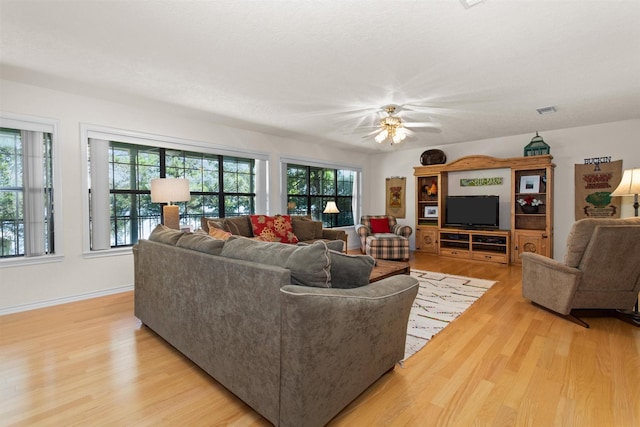 386 Dailey Rd, Crockett, TX 75835 - living room with light wood finished floors, healthy amount of natural light, and ceiling fan