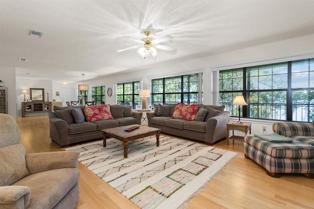 386 Dailey Rd, Crockett, TX 75835 - living area featuring light wood finished floors and a ceiling fan