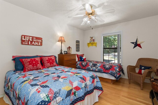 386 Dailey Rd, Crockett, TX 75835 - bedroom featuring wood finished floors and ceiling fan