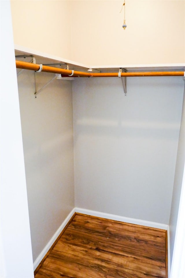 6410 Del Monte Dr Unit 118, Houston, TX 77057 - walk in closet featuring wood finished floors