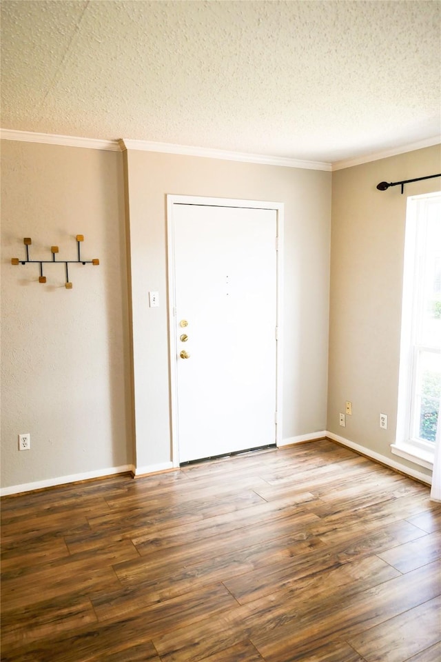 6410 Del Monte Dr Unit 118, Houston, TX 77057 - entrance foyer with wood finished floors, crown molding, and a textured ceiling