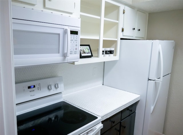 6410 Del Monte Dr Unit 118, Houston, TX 77057 - kitchen with white appliances, white cabinetry, and light countertops