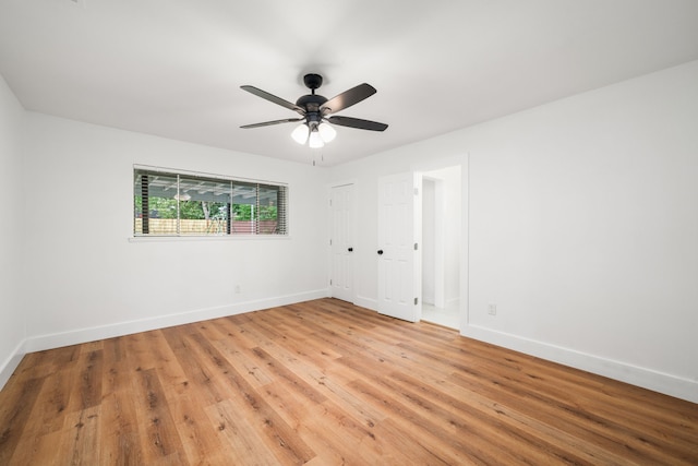 9030 Tanager St, Houston, TX 77036 - unfurnished bedroom featuring light wood-style floors and ceiling fan