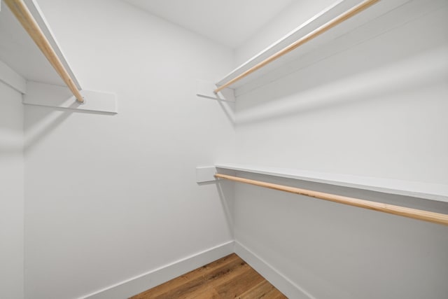 9030 Tanager St, Houston, TX 77036 - walk in closet with wood finished floors