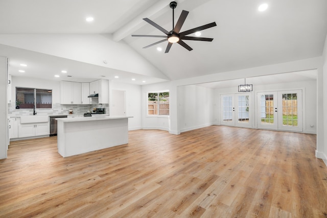 9030 Tanager St, Houston, TX 77036 - unfurnished living room featuring beam ceiling, a ceiling fan, recessed lighting, light wood finished floors, and high vaulted ceiling