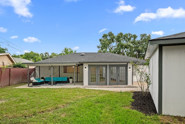 9030 Tanager St, Houston, TX 77036 - back of house featuring french doors, outdoor lounge area, a patio, and roof with shingles