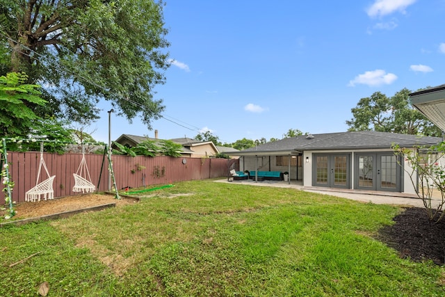 9030 Tanager St, Houston, TX 77036 - fenced backyard with french doors, outdoor lounge area, and a patio area