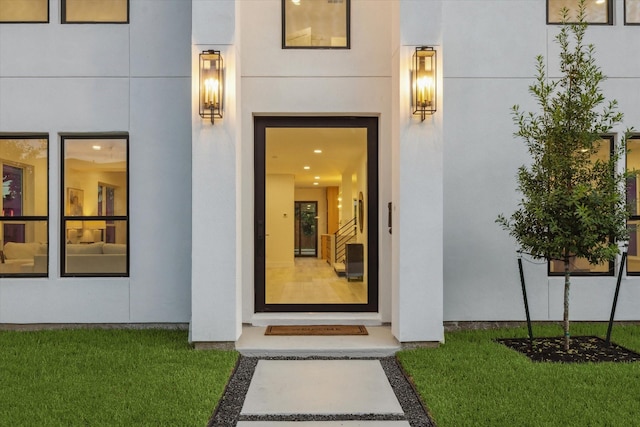 5005 Chestnut St, Bellaire, TX 77401 - property entrance featuring stucco siding and a yard