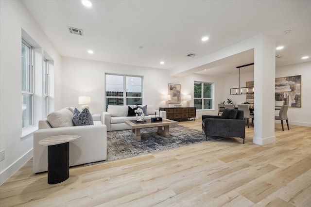 5005 Chestnut St, Bellaire, TX 77401 - living room with wood finished floors and recessed lighting
