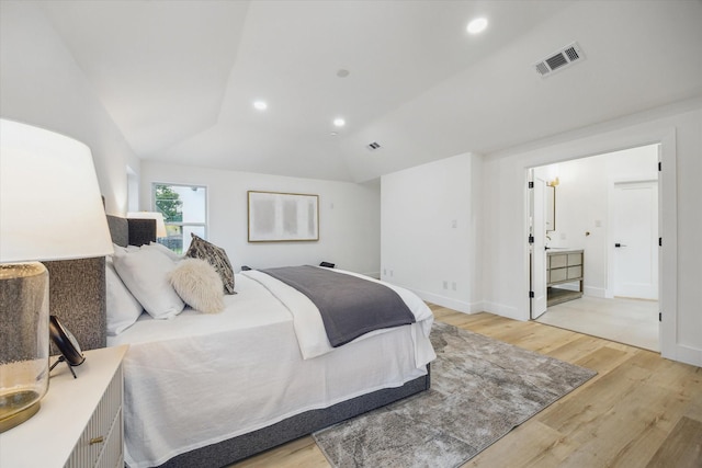 5005 Chestnut St, Bellaire, TX 77401 - bedroom featuring light wood-style floors, vaulted ceiling, and recessed lighting