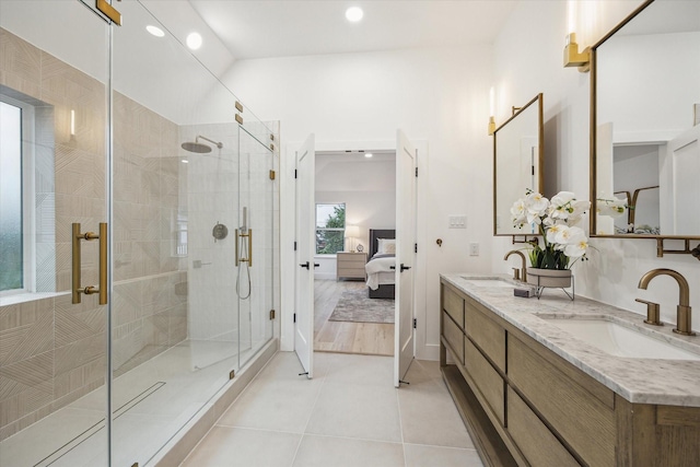 5005 Chestnut St, Bellaire, TX 77401 - ensuite bathroom featuring recessed lighting, a shower stall, double vanity, and tile patterned floors