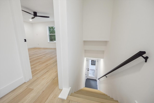 5005 Chestnut St, Bellaire, TX 77401 - staircase featuring wood finished floors, a ceiling fan, and recessed lighting