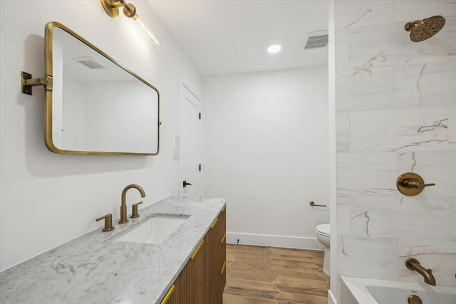 5005 Chestnut St, Bellaire, TX 77401 - full bath featuring vanity, wood finished floors, recessed lighting, and bathing tub / shower combination