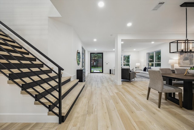 5005 Chestnut St, Bellaire, TX 77401 - foyer with stairway, light wood-style flooring, recessed lighting, and a chandelier