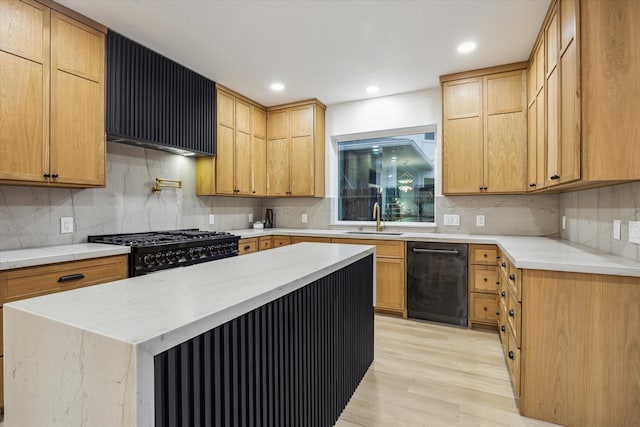 5005 Chestnut St, Bellaire, TX 77401 - kitchen with black appliances, light wood-type flooring, tasteful backsplash, wall chimney range hood, and recessed lighting