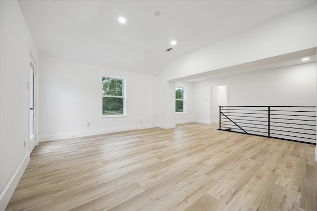 5005 Chestnut St, Bellaire, TX 77401 - spare room featuring light wood-style floors, recessed lighting, and vaulted ceiling