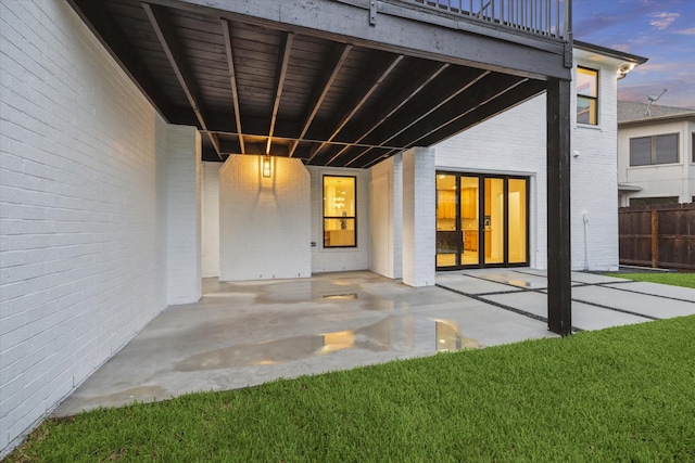 5005 Chestnut St, Bellaire, TX 77401 - view of exterior entry featuring a patio and brick siding