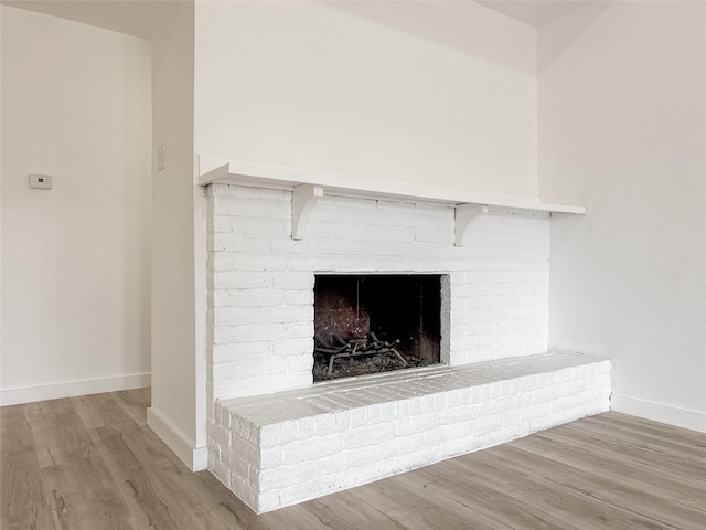 14214 Morinscott, Houston, TX 77049 - detailed view of wood finished floors and a fireplace