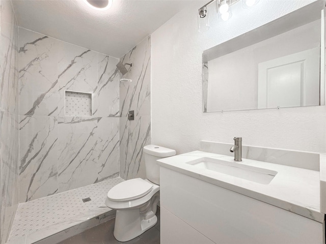14214 Morinscott, Houston, TX 77049 - full bath with vanity, a marble finish shower, a textured wall, and a textured ceiling