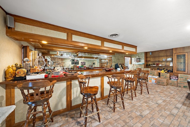 8105 Miller Dr, Hitchcock, TX 77563 - indoor bar featuring brick patterned floors